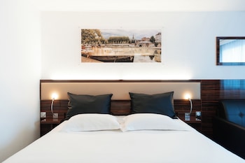 Chambre EXECUTIVE grand lit et canapé-lit pour enfant de 12 ans maximum